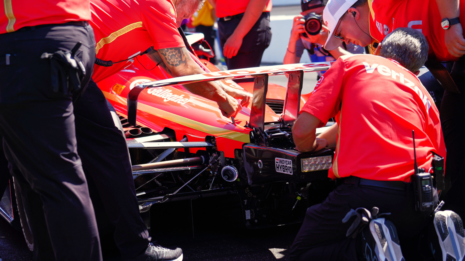 The Team Penske crew hard at work reattaching the rear wing on pit lane. Photo: Kevin Dejewski