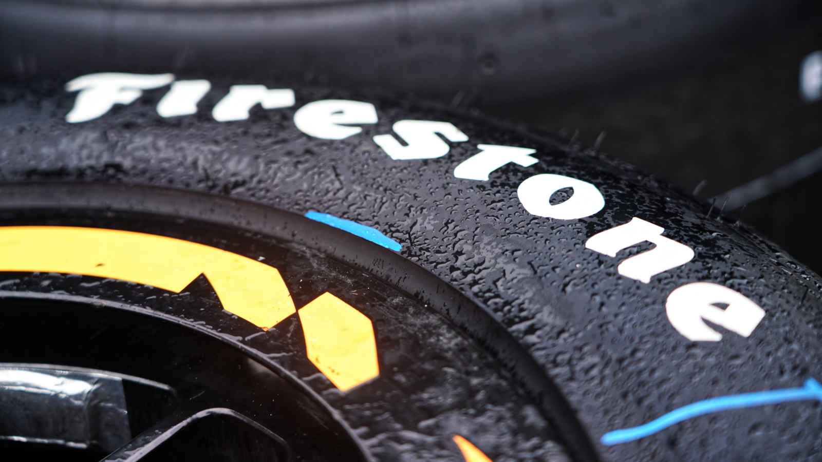 Rain falls on tires in the pit lane. Photo: Kevin Dejewski