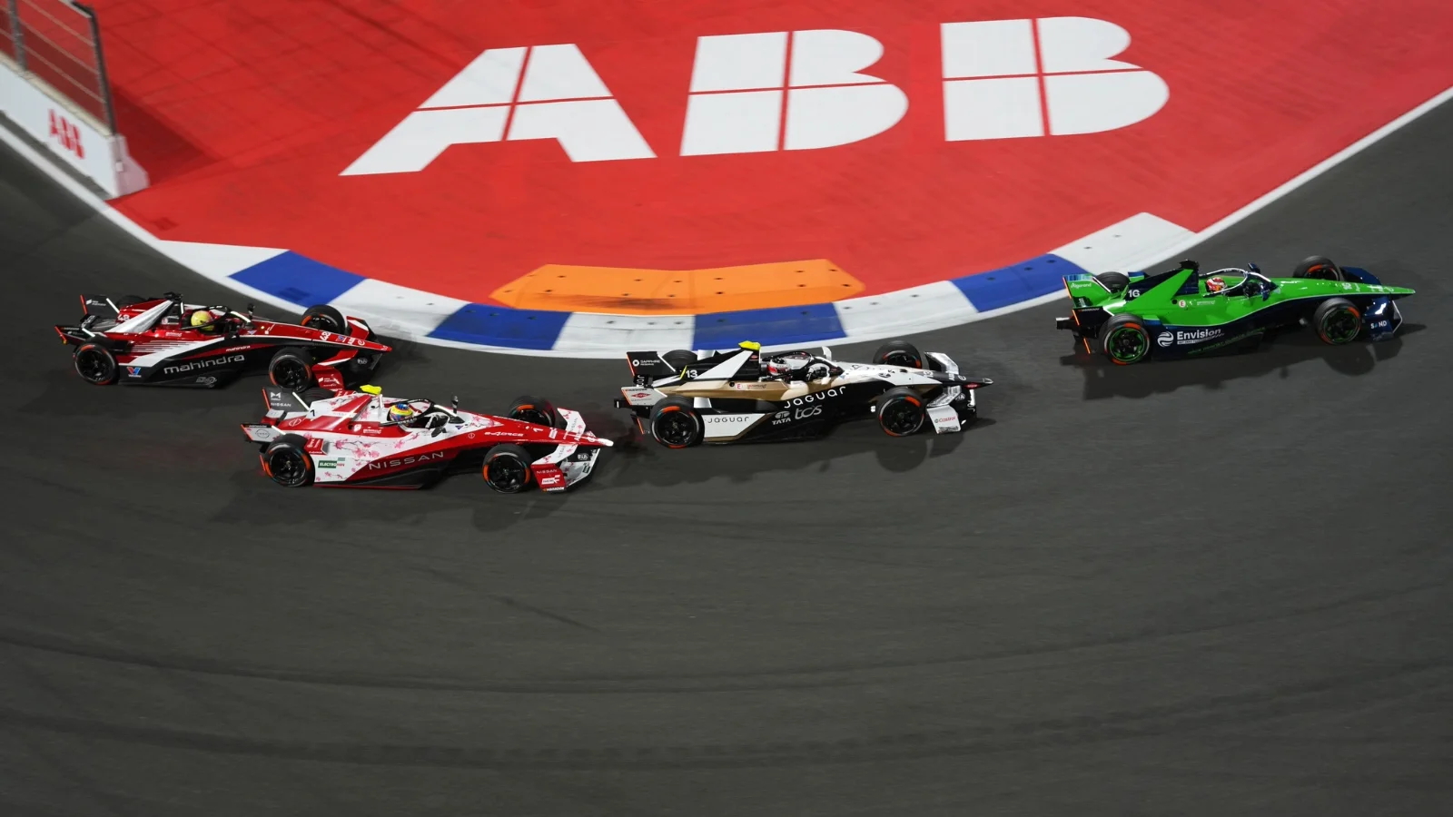 JEDDAH, SAUDI ARABIA - FEBRUARY 14: Antonio Felix da Costa of Portugal driving the (13) Jaguar TCS Racing Jaguar I-TYPE 7 leads Oliver Rowland of Great Britain driving the (1) Nissan Formula E Team Nissan e-4ORCE 05 on track during the Jeddah E-Prix, Round 5 of the 2026 FIA Formula E World Championship at Jeddah Corniche Circuit on February 14, 2026 in Jeddah, Saudi Arabia.