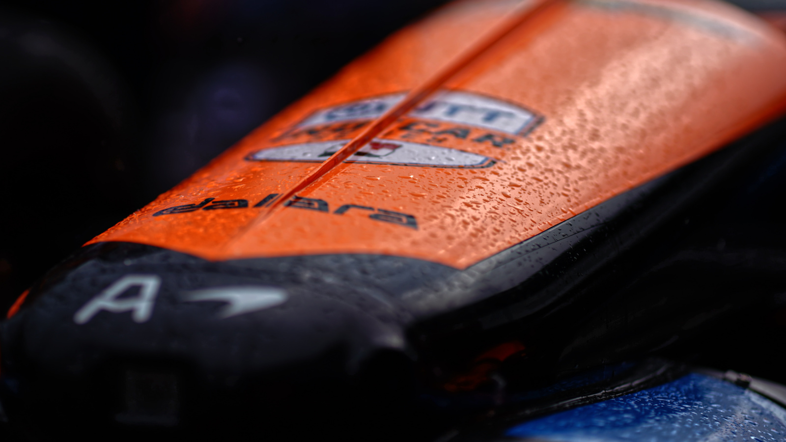 Rain falls on cars as they are pushed back to the garage area. Photo: Kevin Dejewski
